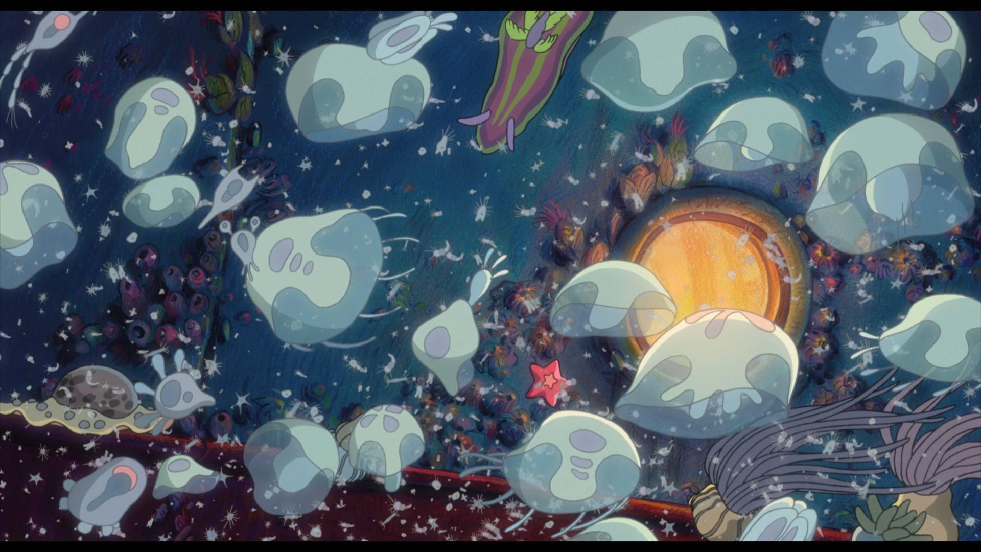 A screencap of the movie Ponyo, with jellyfish and sea boogers dancing across the sea